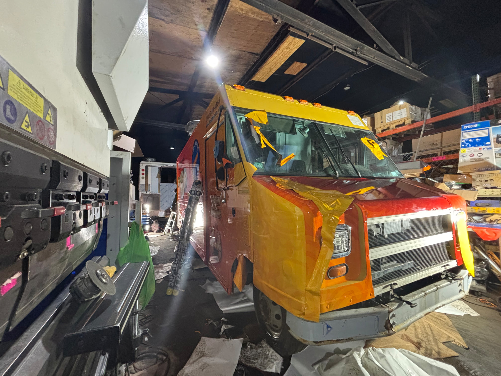 Step van fleet vehicle being wrapped in orange and yellow gradient film