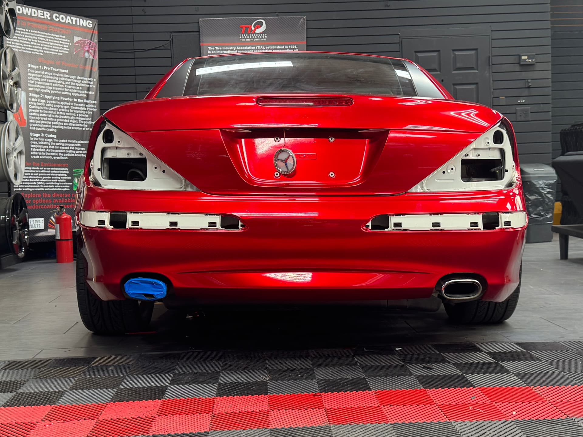 Mercedes SL rear end wrapped in gloss red with trim removed