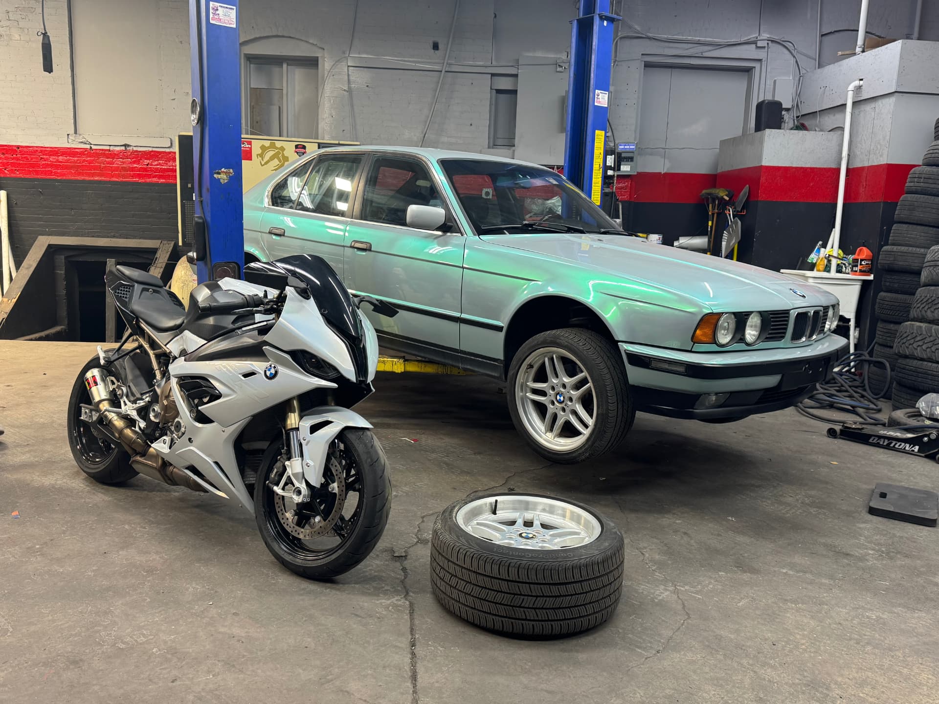 Classic BMW sedan wrapped in a mint pearl color shift film