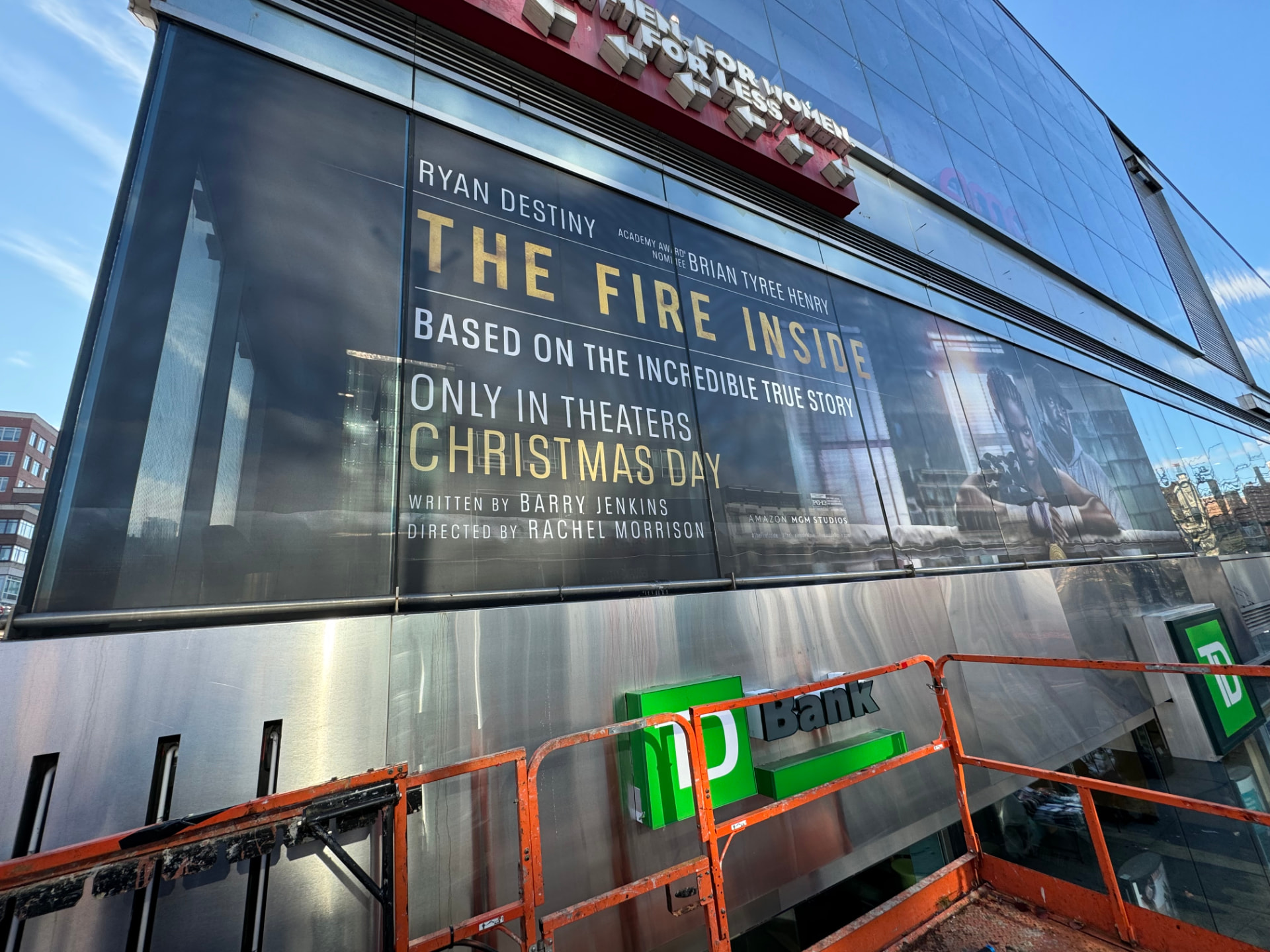 Movie campaign window graphics installed on a theater glass facade