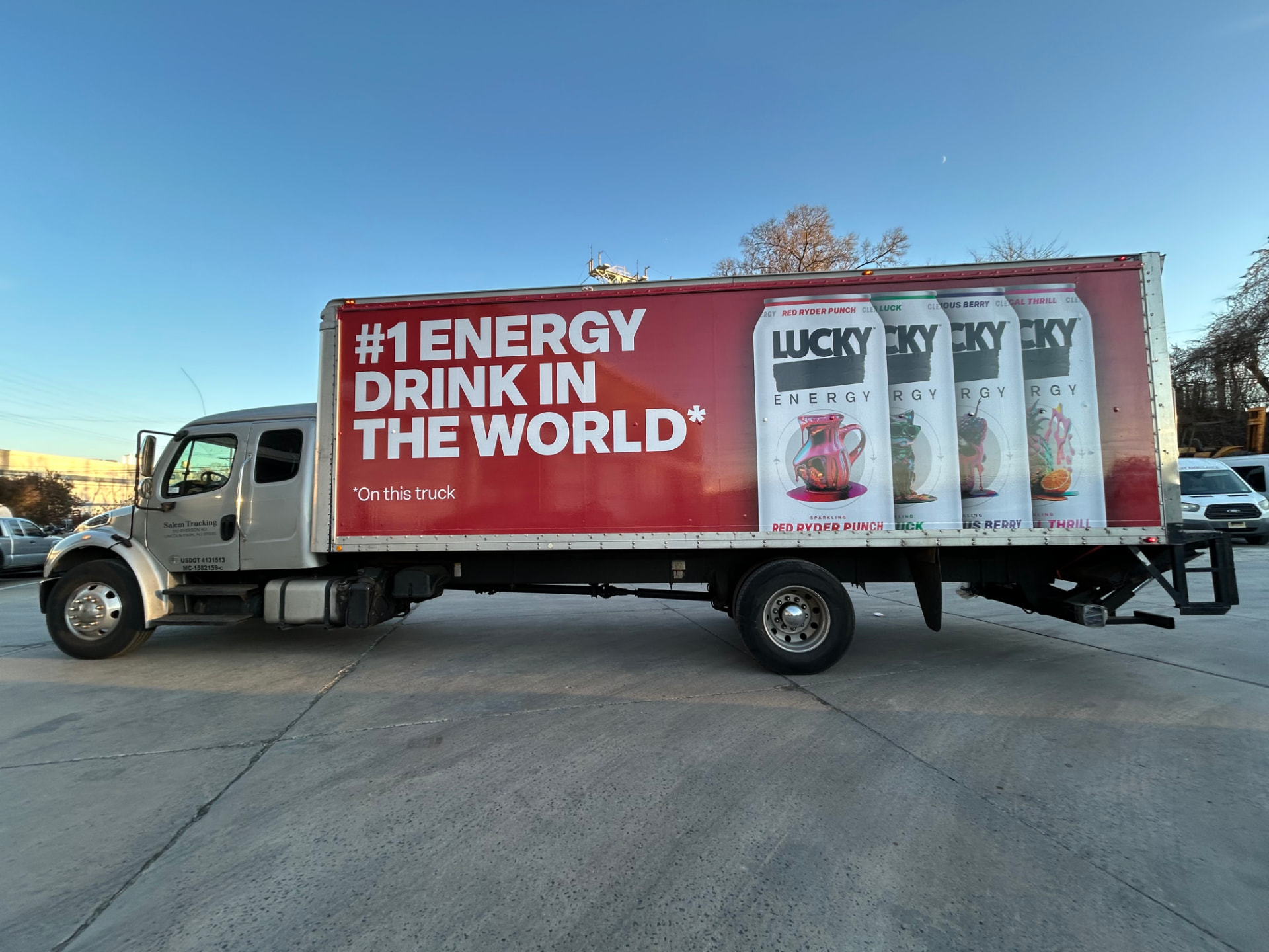 Red Lucky Energy box truck wrap advertising the drink lineup