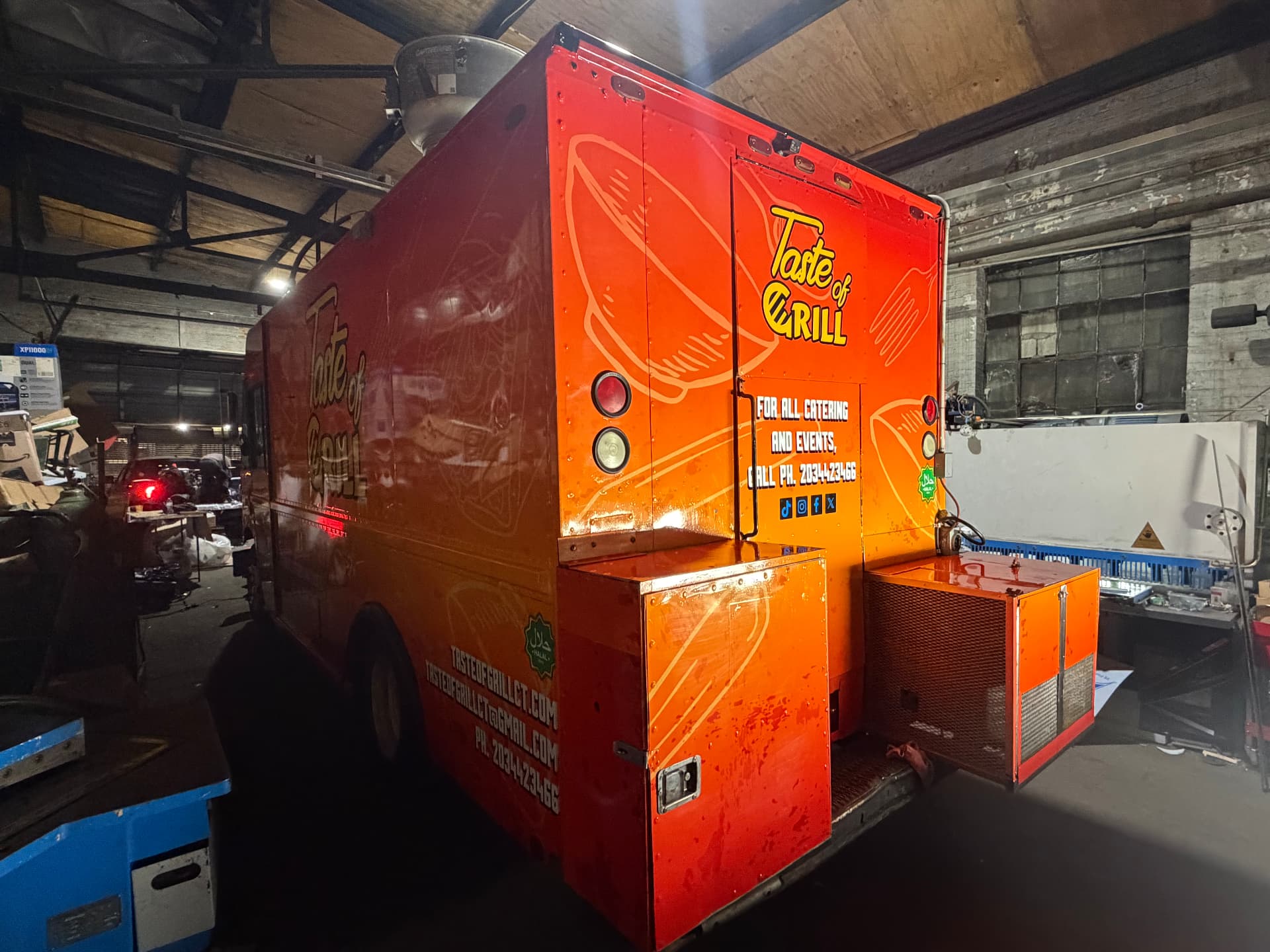Orange Taste of Grill food truck wrap with full-color printed graphics